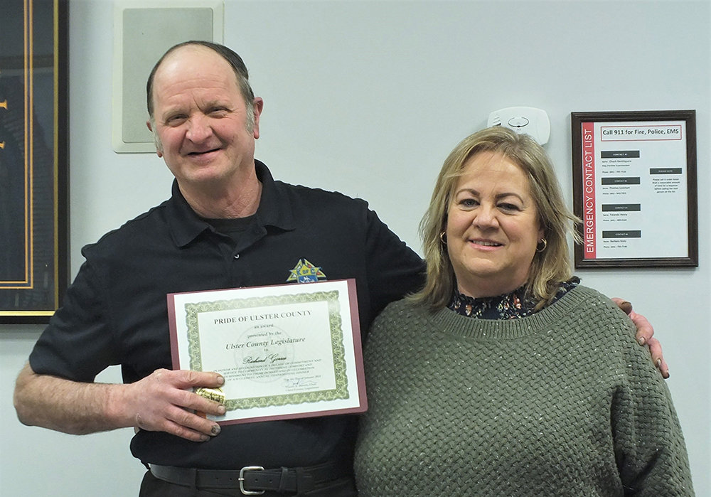 Ulster County Legislator Gina Hansut presented Rich Gorres with a Pride of Ulster County award for running the annual St Augustine Thanksgiving Dinner for the past ten years.